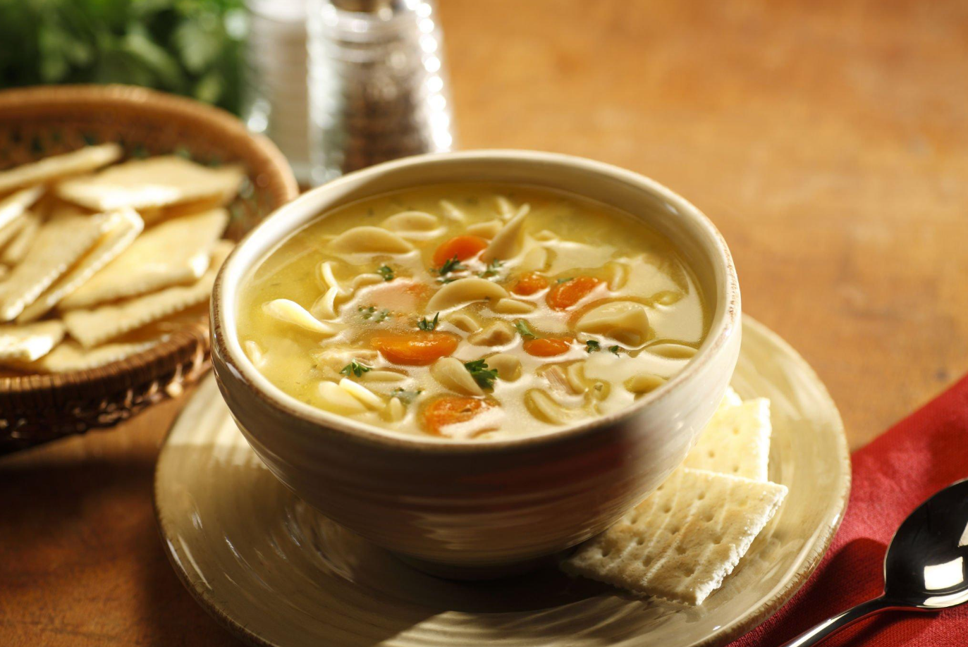 Assorted freezer-safe containers for chicken soup storage